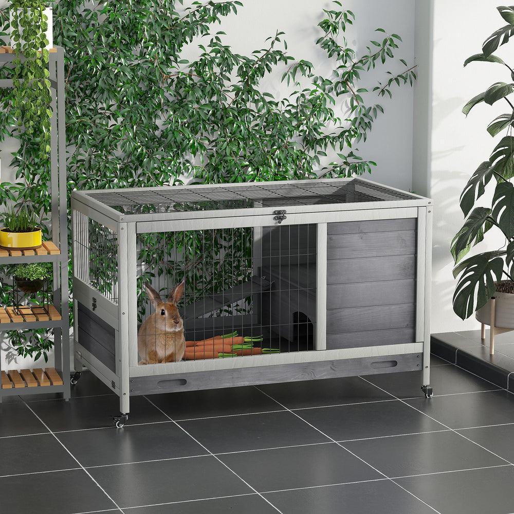 Indoor wooden hutch with enclosed run and wheels