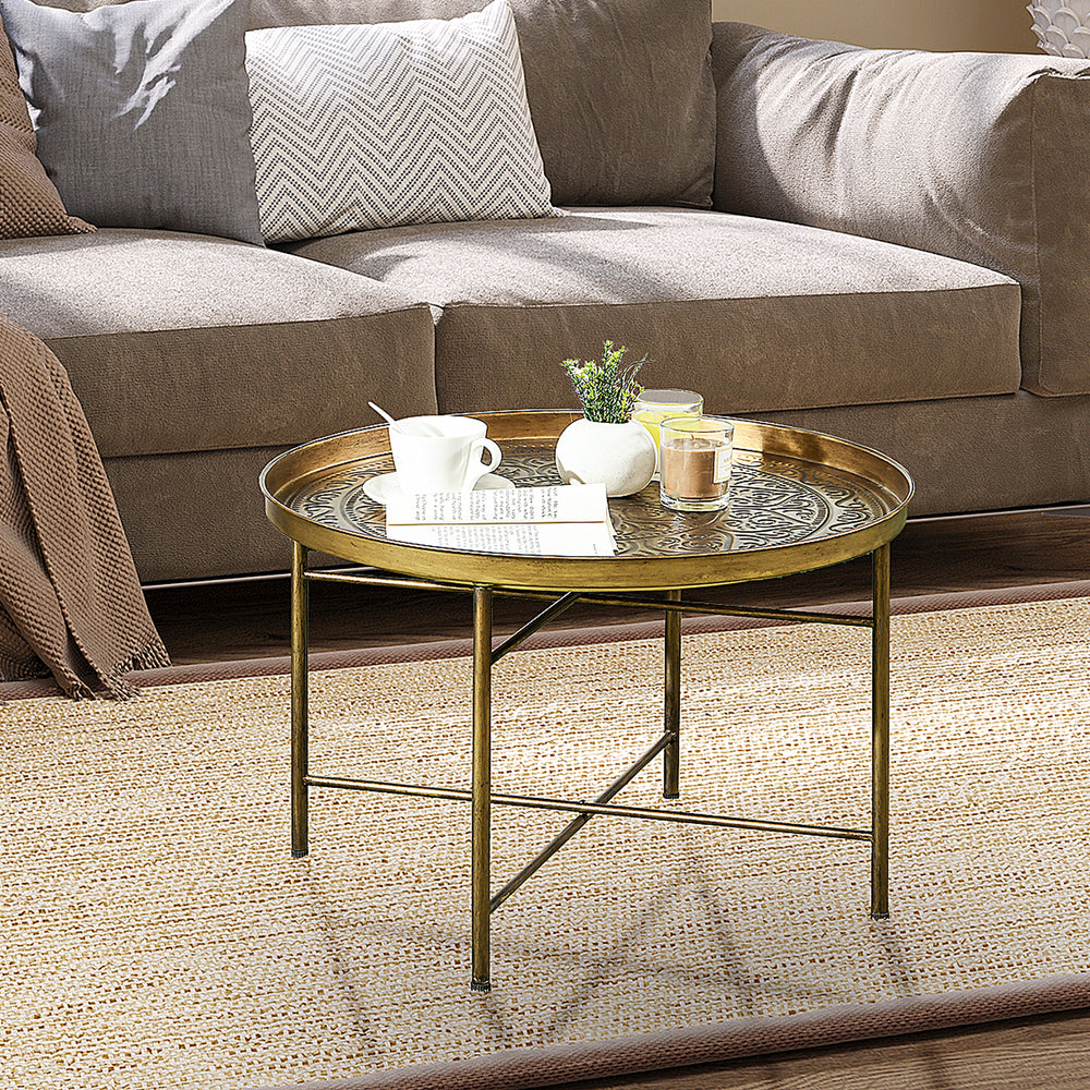 Vintage round coffee table with hammered top and metal frame, gold