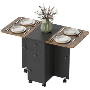 Drop-leaf dining table on casters with drawers and cupboard, rustic brown and black.