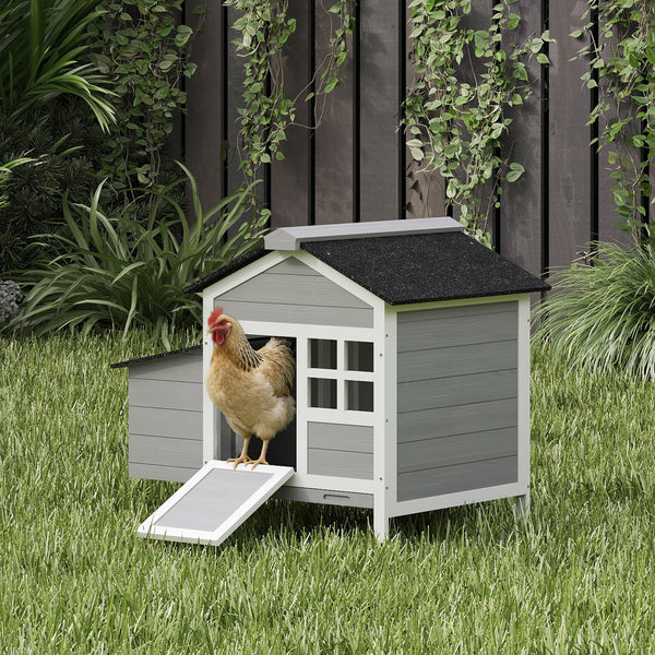Wooden chicken coop with nesting box and removable metal tray
