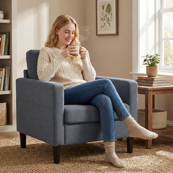 Modern upholstered armchair with thick, padded seat and armrests, dark grey 