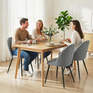 Set of 4 modern dining chairs, upholstered with metal legs, shell back and padded seat, grey.
