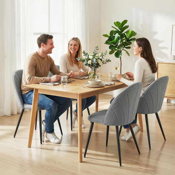 Set of 4 modern dining chairs, upholstered with metal legs, shell back and padded seat, grey.