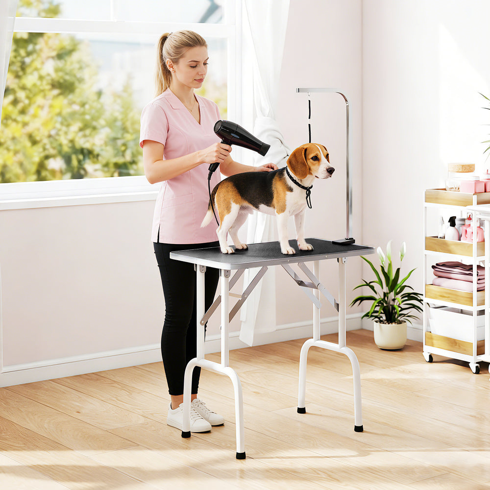 Foldable grooming table with adjustable arm and non-slip surface, black