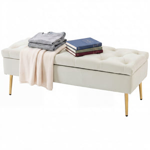 Tufted bedroom bench with gold metal legs and thick padding, beige