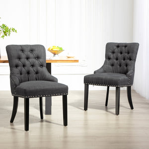 Set of 2 linen dining chairs with studded trim and wooden legs, dark grey