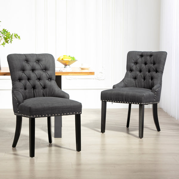 Set of 2 linen dining chairs with studded trim and wooden legs, dark grey