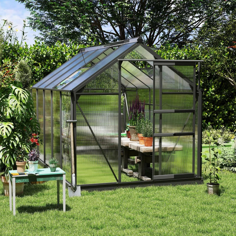 Polycarbonate greenhouse with gutter, vents and sliding door
