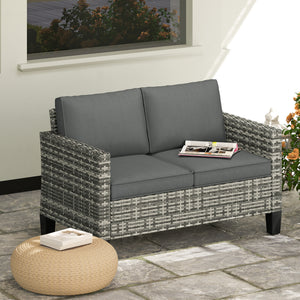 Two-seater outdoor rattan sofa with cushions and armrests, dark grey