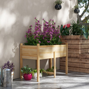 Raised wooden planter with drainage holes for vegetables, natural