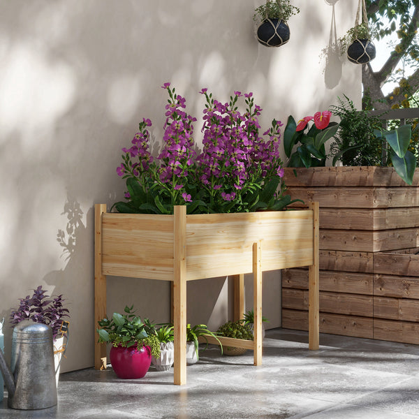 Raised wooden planter with drainage holes for vegetables, natural