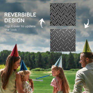 Reversible waterproof outdoor rug made of plastic straw, black and grey geometric pattern