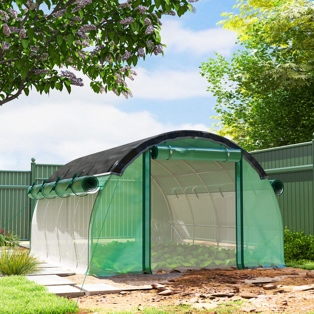 Heated tunnel greenhouse with shade netting, roll-up mesh side panels, green