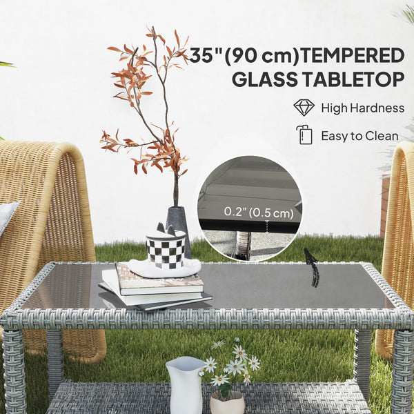 Outdoor coffee table in woven resin with glass top and storage shelf, grey