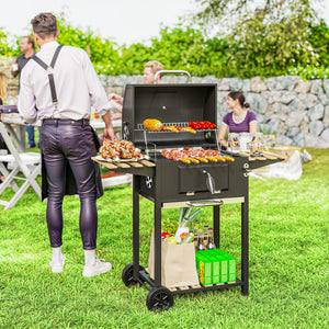 Charcoal barbecue on wheels with adjustable charcoal tray