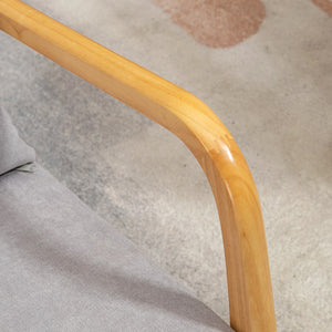 Fabric lounge chair with wooden legs and thick padding, gray