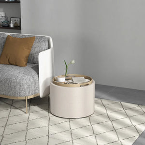 Round coffee table with hidden storage and linen upholstered top