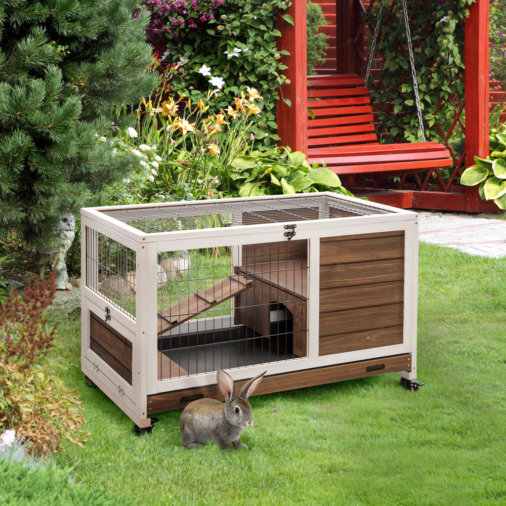 Wooden hutch with enclosed run and wheels, brown