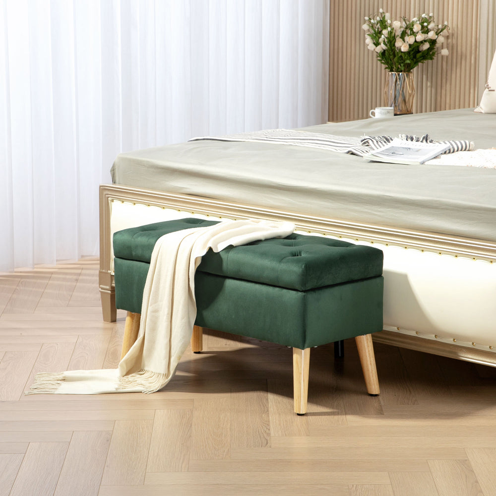 Storage ottoman with velvet upholstered lid and wooden legs, dark green
