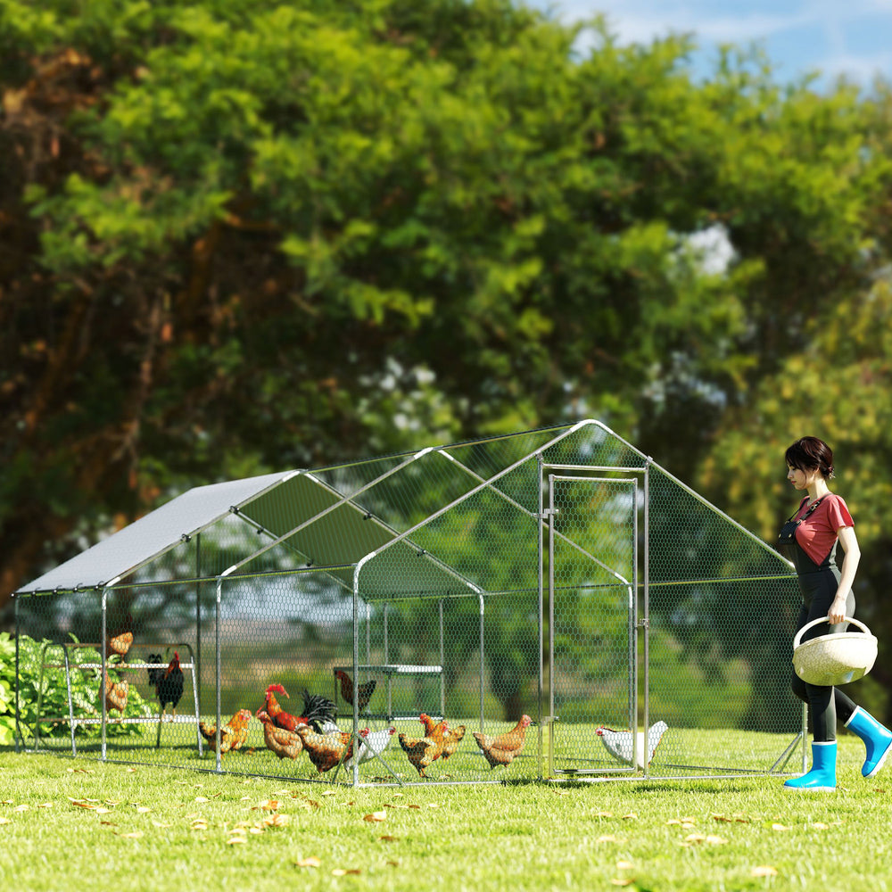 Metal chicken coop with waterproof tarp, nesting box, and perches