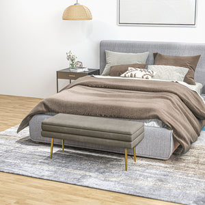 Velvet storage pouf with steel legs