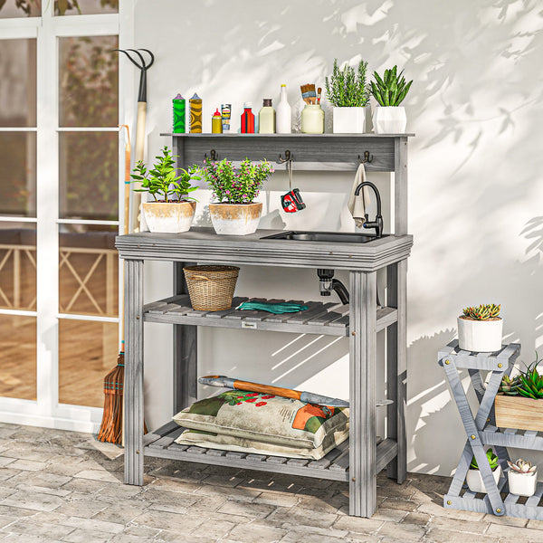 Outdoor potting table with tap, removable sink, hooks and storage shelves