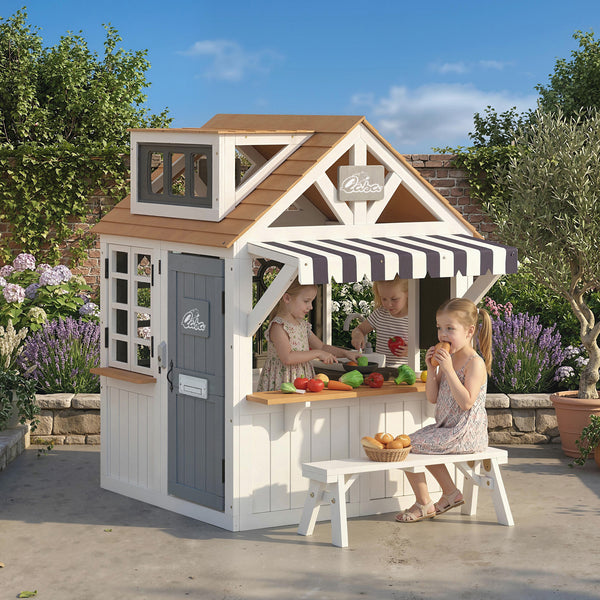 Wooden playhouse for children with cat flap, kitchen utensils, blackboard, bench, and doorbell
