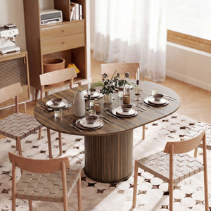 Extendable kitchen table for 6 to 8 people, farmhouse style, with a central pedestal and a walnut finish.