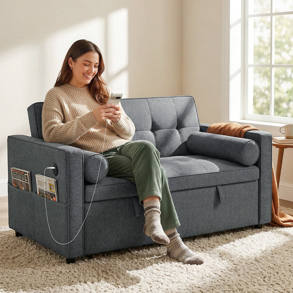 Dark grey two-seater linen trundle sofa bed with USB ports