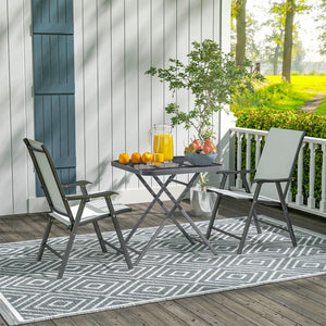 Folding square patio table with a gridded rattan top
