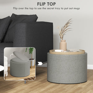 Round coffee table with hidden storage and gray linen upholstered top