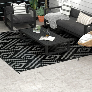 Reversible waterproof outdoor rug made of plastic straw, black and grey geometric pattern
