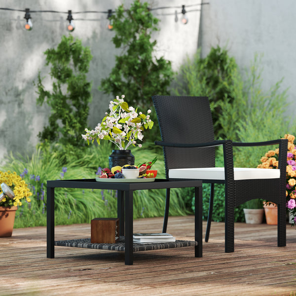 Outdoor coffee table with tempered glass top and storage shelf, black