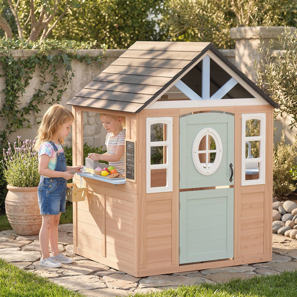 Outdoor wooden playhouse with cat flap, play kitchen, half door and windows for indoor and outdoor use.