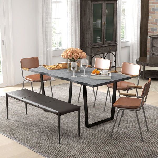 Industrial dining table with wavy edge top and steel legs, seats up to 6, cement gray