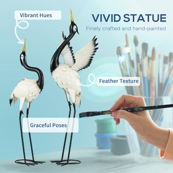 Set of 2 heron statues, white and black