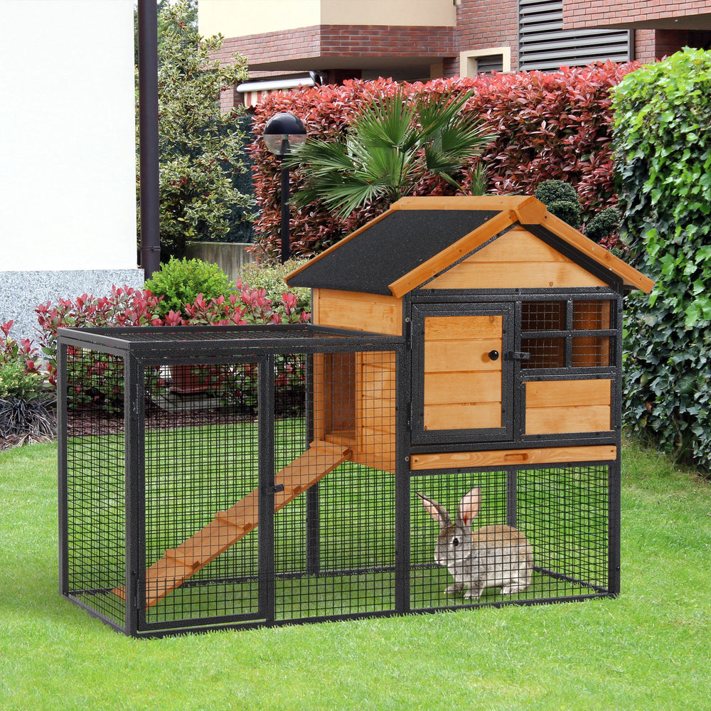Outdoor hutch with run, sturdy metal frame, asphalt roof, and access ramp