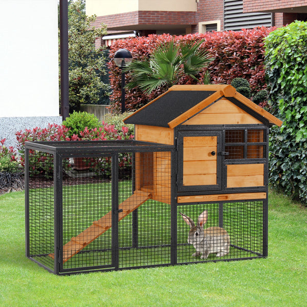Outdoor hutch with run, sturdy metal frame, asphalt roof, and access ramp