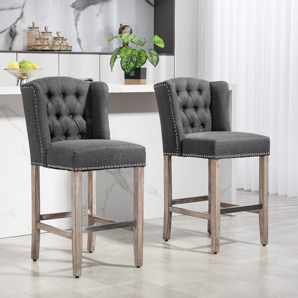 Set of 2 upholstered bar stools with studded backrest and footrest, dark grey