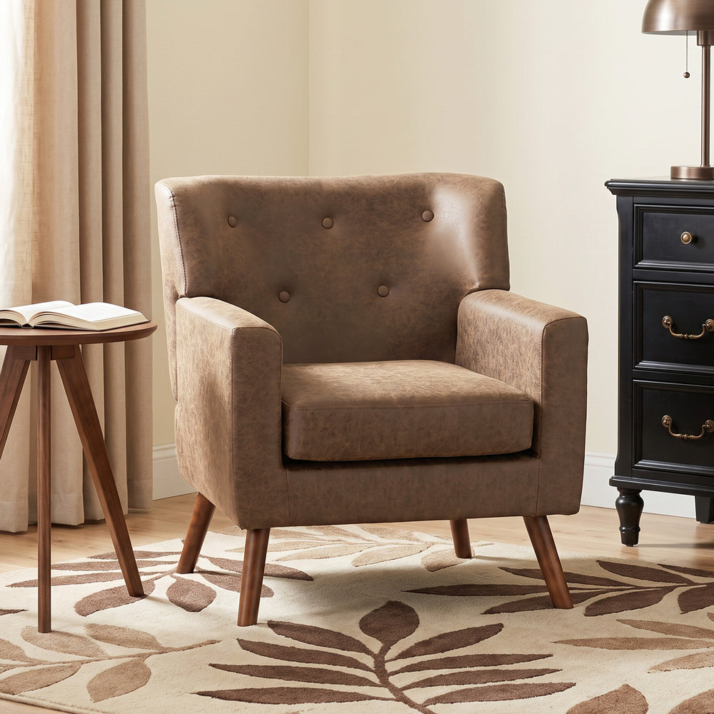 Tufted armchair in brown faux leather, wooden legs