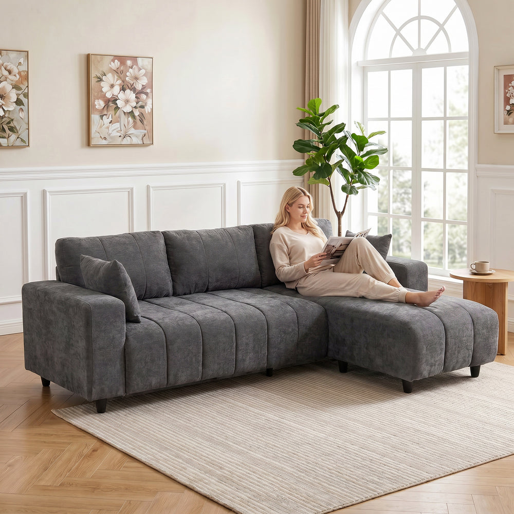 L-shaped sectional sofa with reversible chaise and pocket springs, dark gray