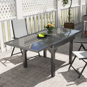 Extendable outdoor table with tempered glass top and metal frame