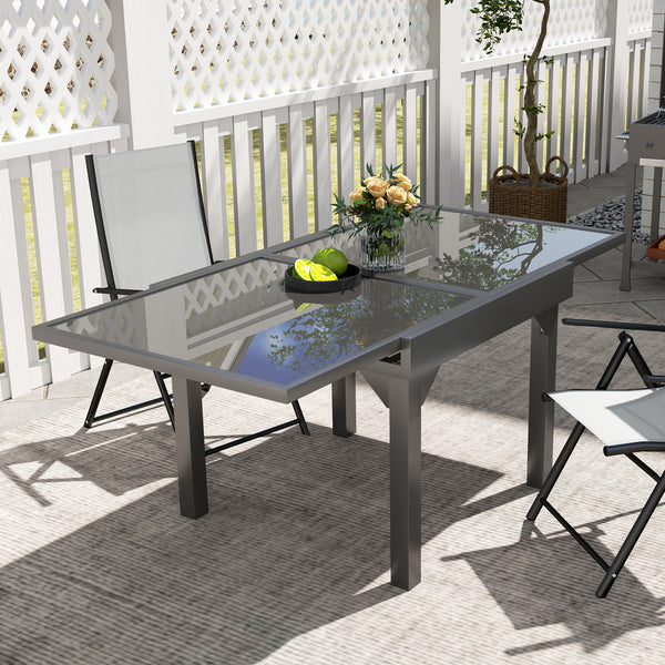Extendable outdoor table with tempered glass top and metal frame
