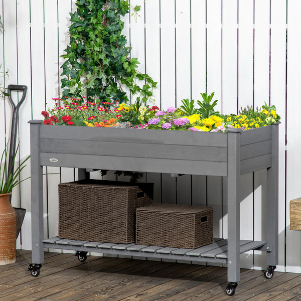Raised wooden planter with lockable casters and storage shelf, dark grey