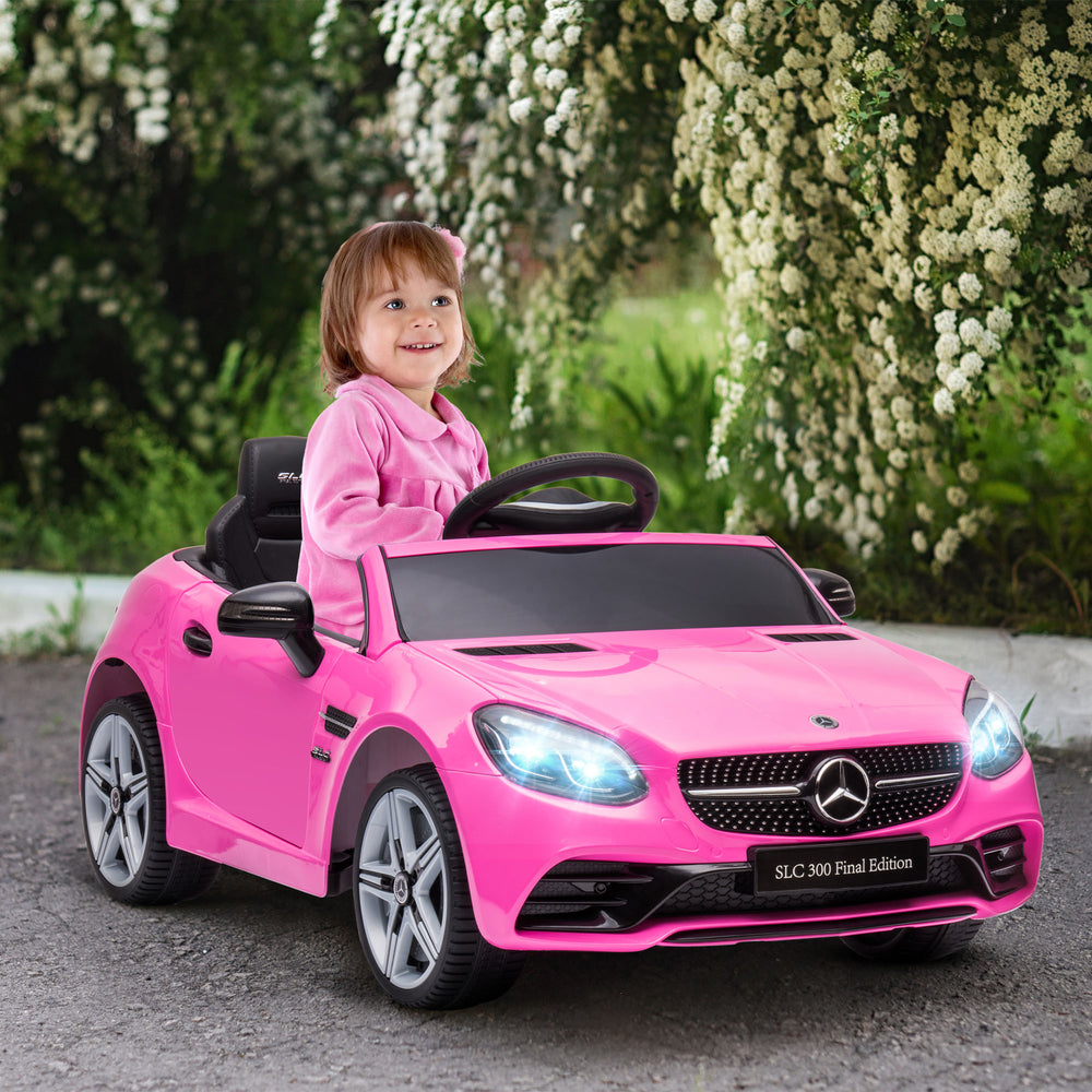 Voiture électrique 12 V pour enfants de 3 à 6 ans, avec télécommande parentale, deux moteurs, lumières, musique et roues avec suspension, couleur rose