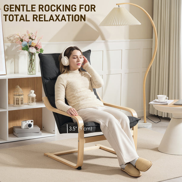 Upholstered accent chair with curved legs and armrests, dark gray