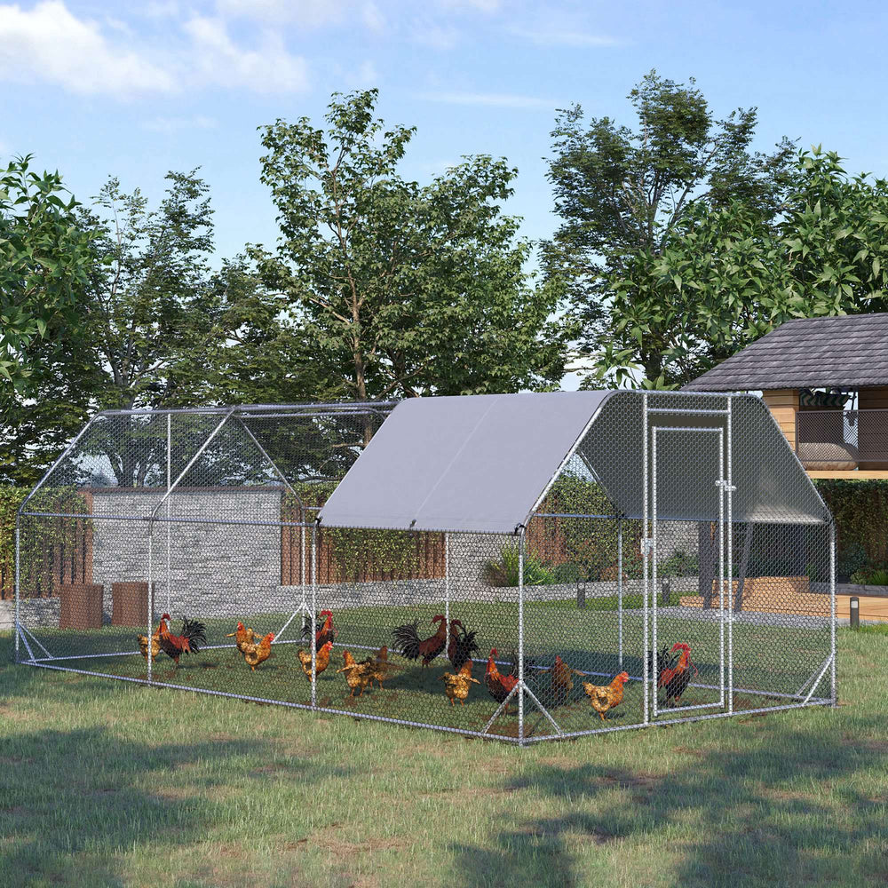 Large galvanized metal chicken coop with flat roof and tarp