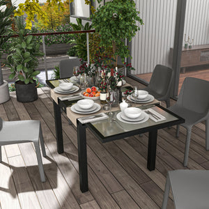 Extendable dining table in aluminum and tempered glass
