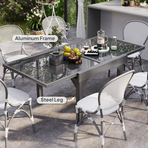 Extendable outdoor table with tempered glass top and metal frame