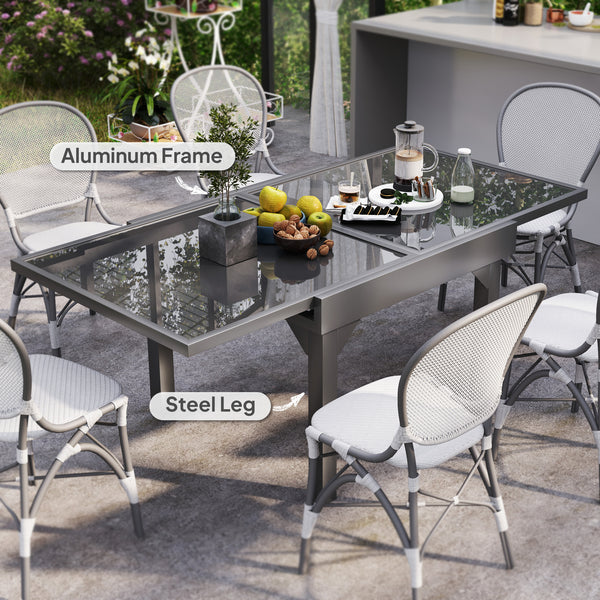 Extendable outdoor table with tempered glass top and metal frame